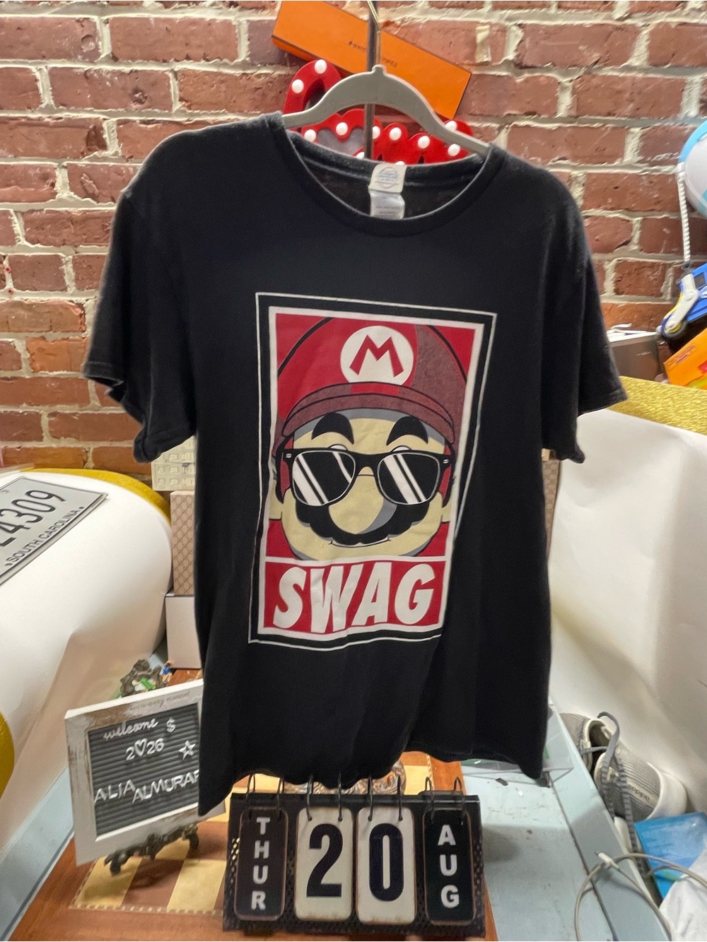 Mario wearing sunglasses inside a red-bordered box with the bold text "SWAG"